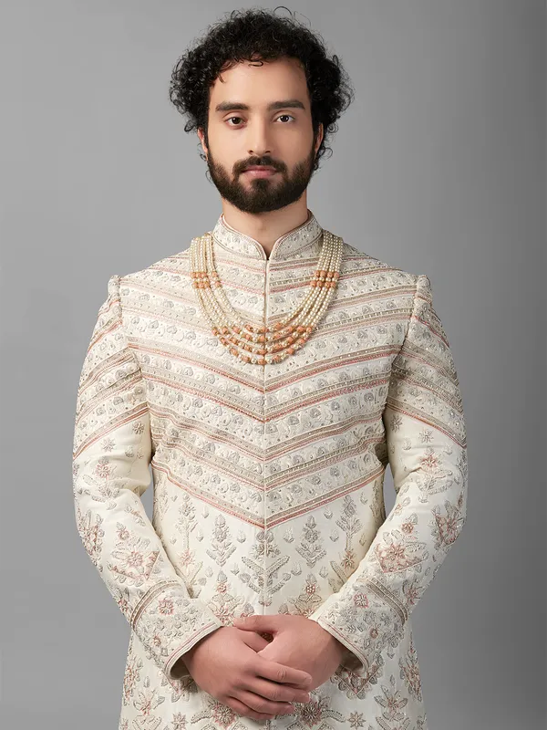 Cream and peach peshwai style sherwani