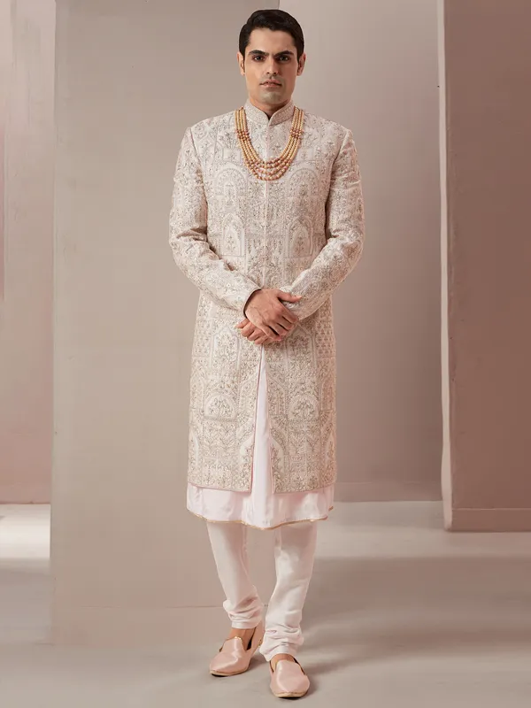 Cream and peach raw silk groom and wedding sherwani