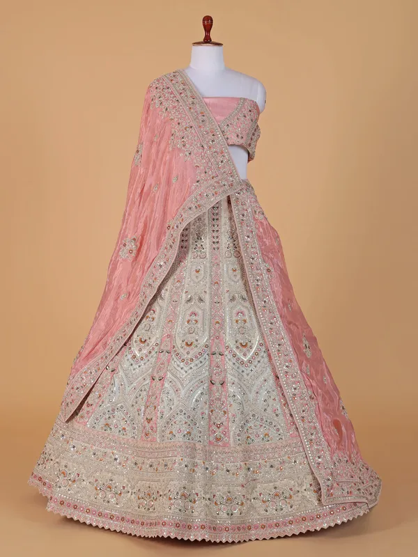 Cream and peach raw silk lehenga choli