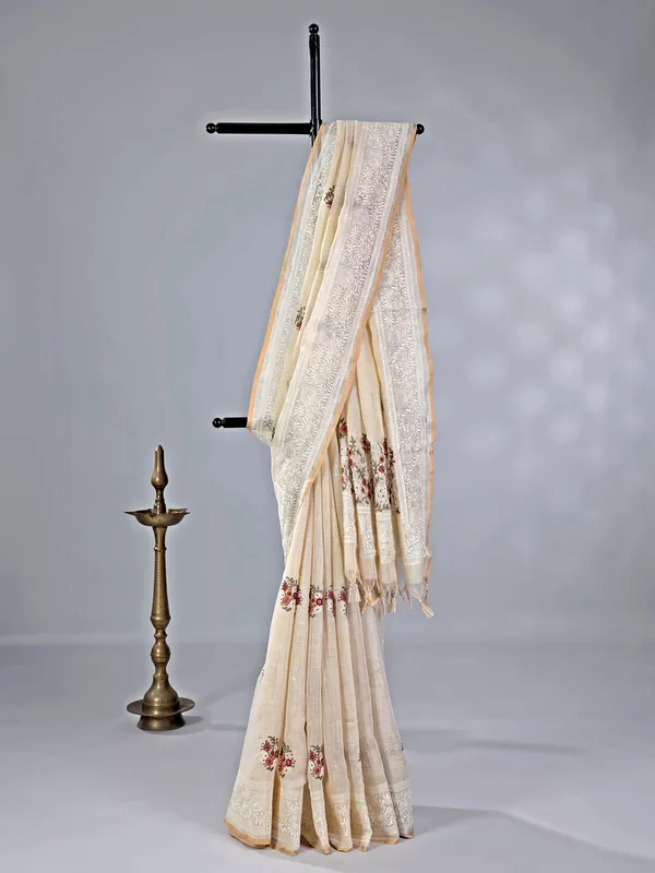 Cream cotton silk saree with embroidery and sequins