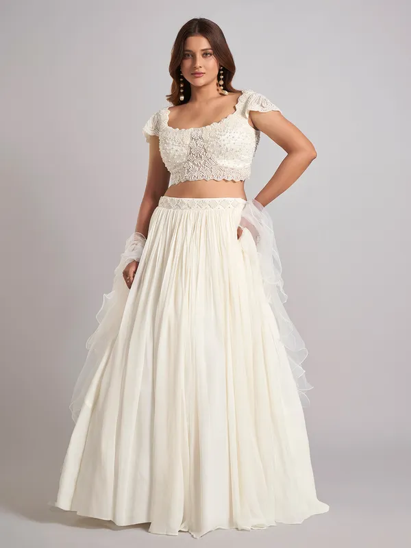 Cream georgette pearl lehenga choli with ruffle dupatta