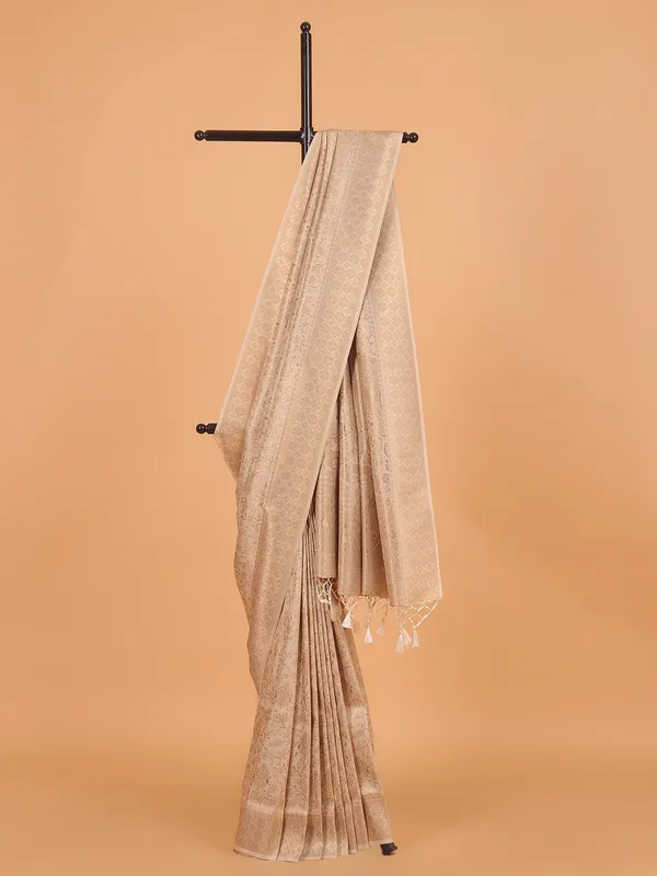 Cream kanjivaram silk saree for festive wear