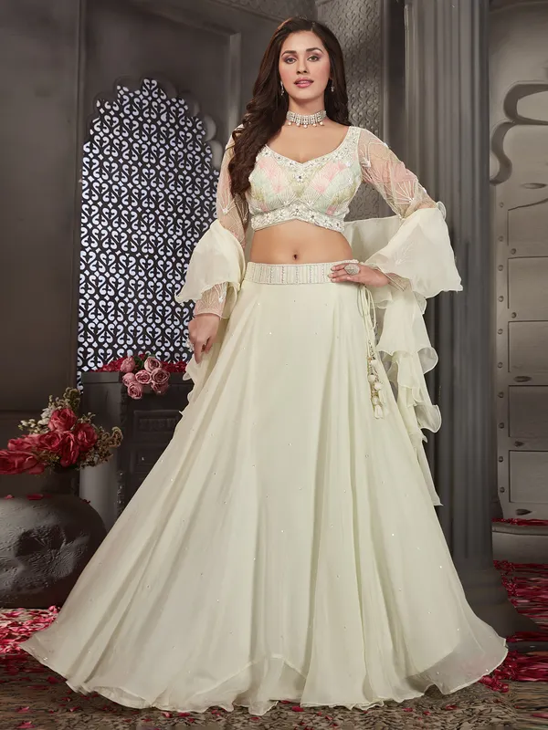 Cream lehenga choli with ruffle dupatta