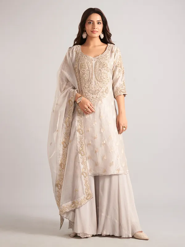 Cream silk palazzo suit with zardosi and cutdana work
