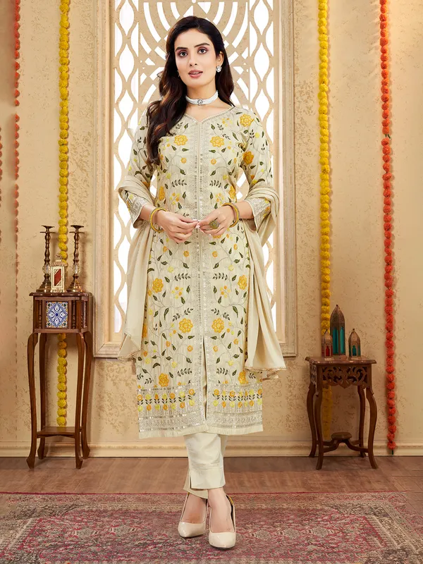 Cream silk salwar suit with zari and and mbellishments