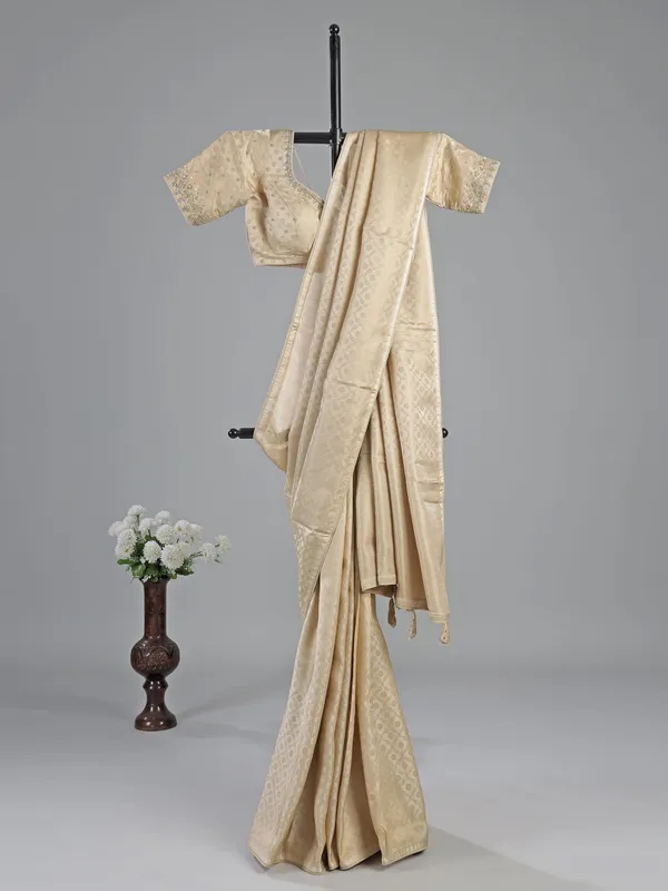 Cream silk saree with readymade work blouse