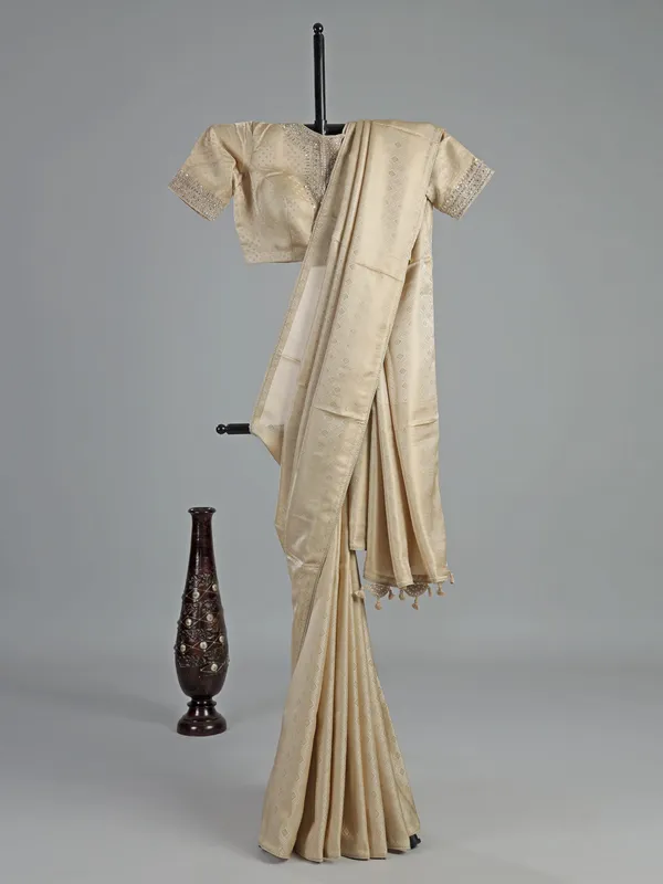 Cream silk saree with zardosi detailing