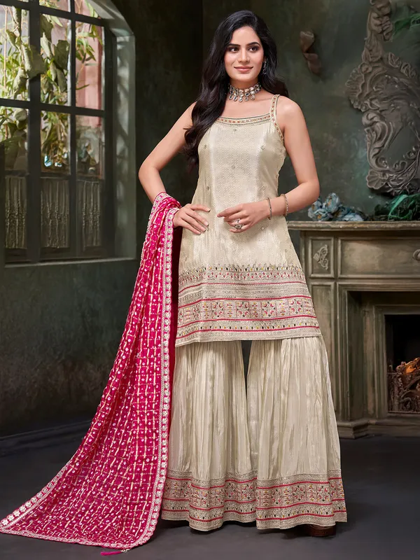 cream silk sharar suit with bold dupatta
