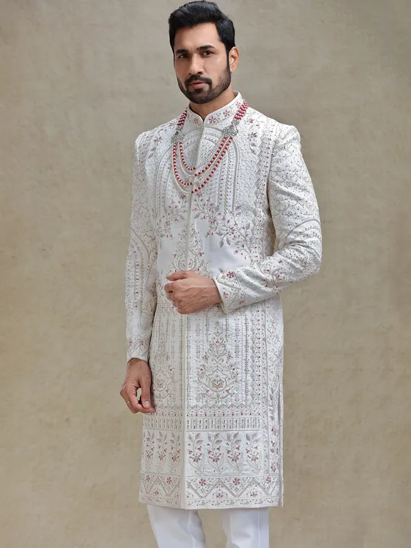 Cream silk sherwani in rich embellishment