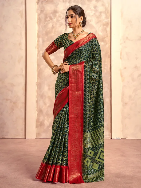 Dark green dola silk zari worked saree