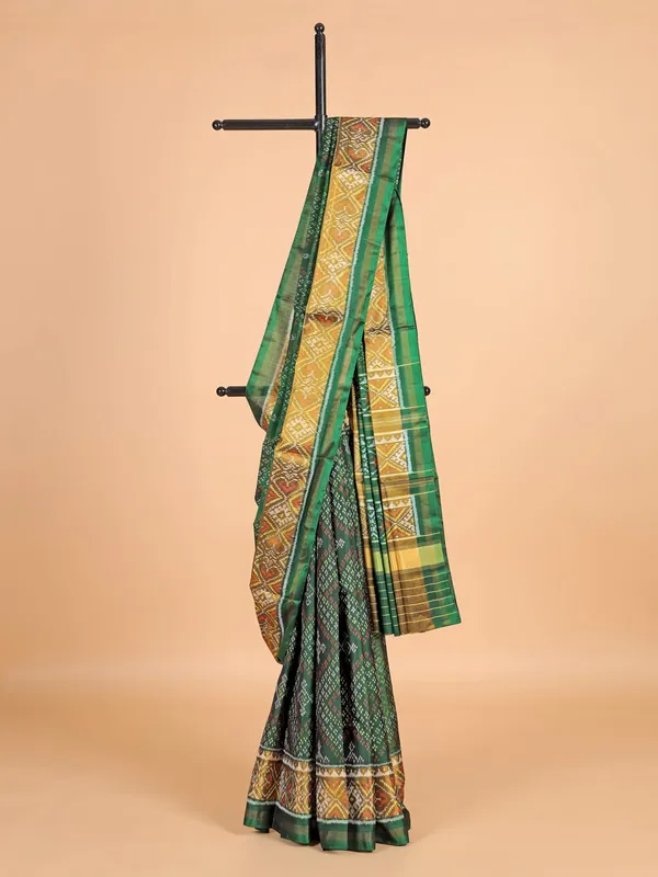 Dark green patola silk saree