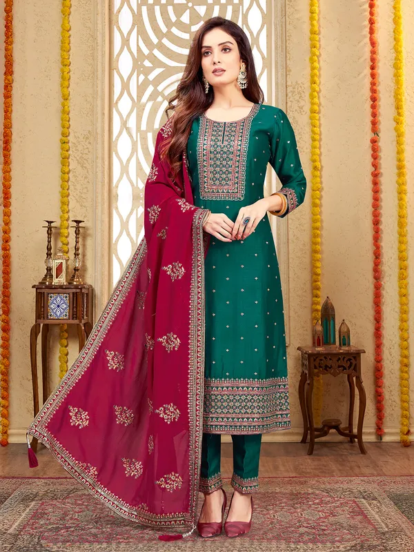 Dark green silk salwar suit with maroon dupatta