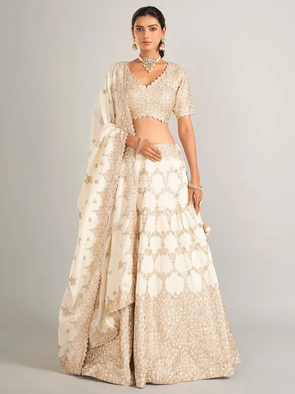 Elegant off-white lehenga choli in raw silk