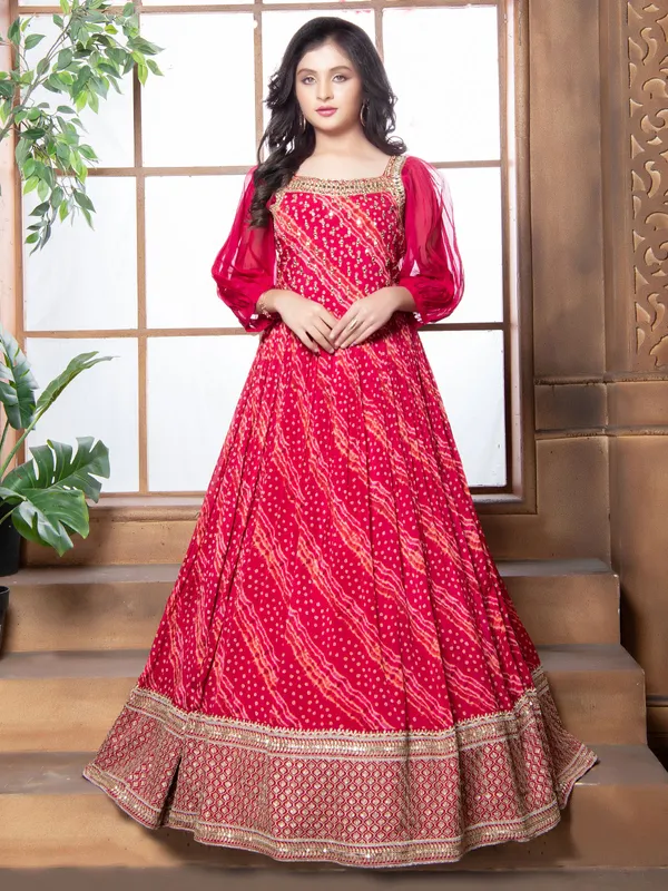 Floor length georgette printed gown in magenta