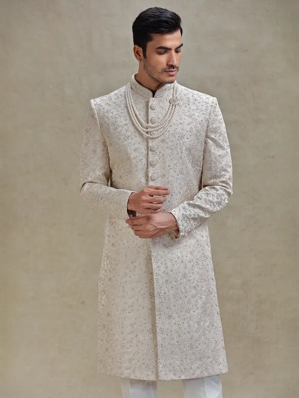 Gold coloured long sherwani in silk for groom