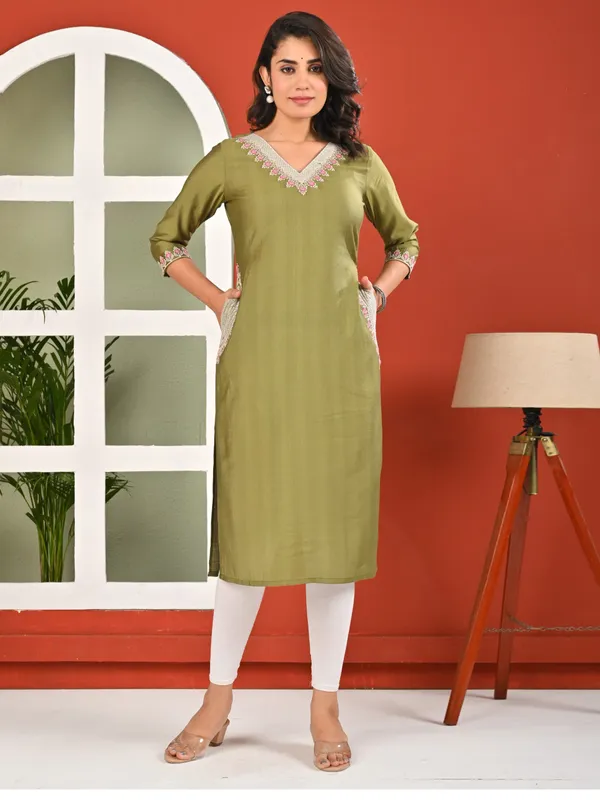 Green cotton silk embroidered kurti with two pockets