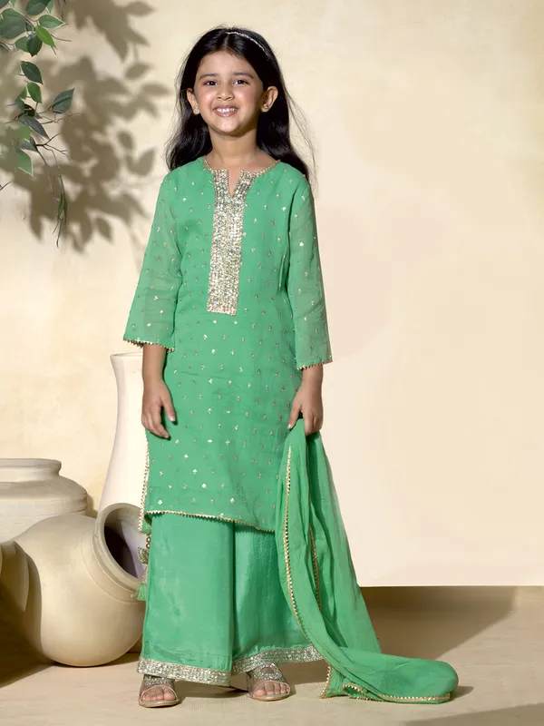 Green cotton silk sequined palazzo salwar suit with dupatta