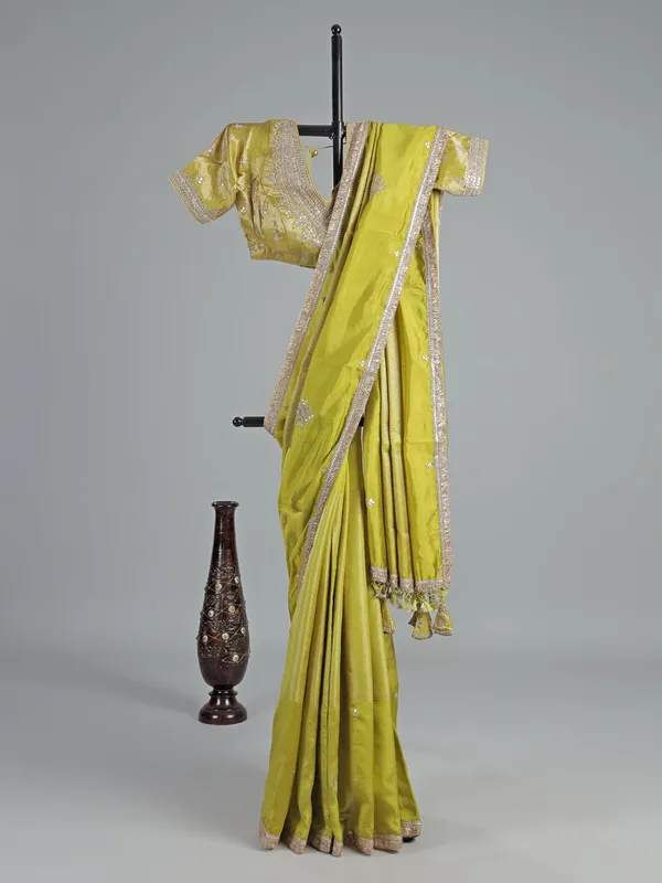 Green dola silk saree with zardosi & gota accents