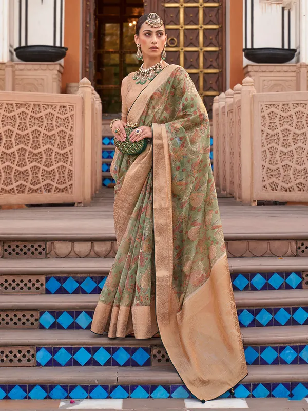 Green organza saree with lush festive shine