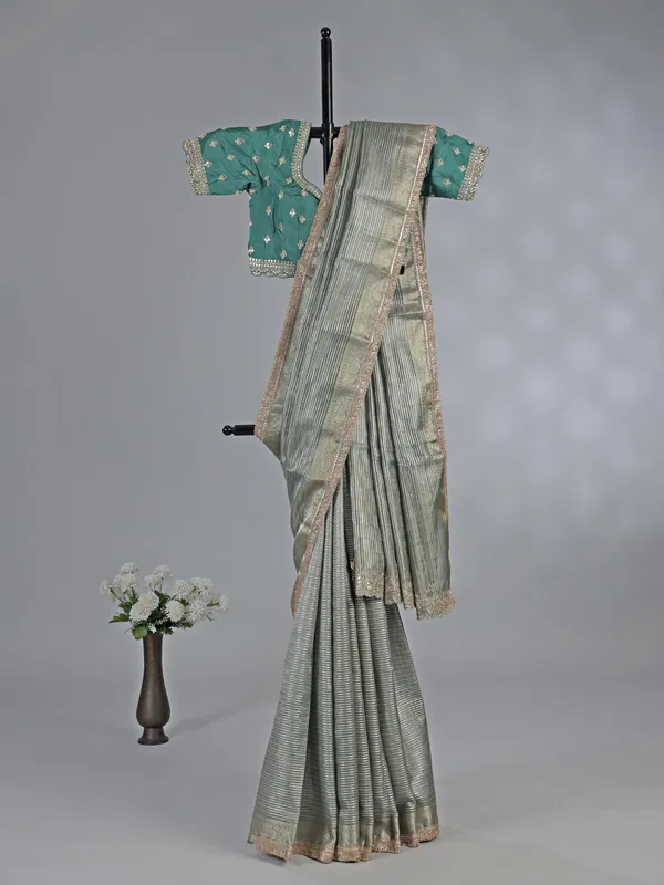 Green organza saree with ready made blouse