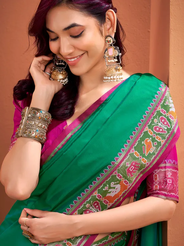 Green patola silk saree with festive radiance