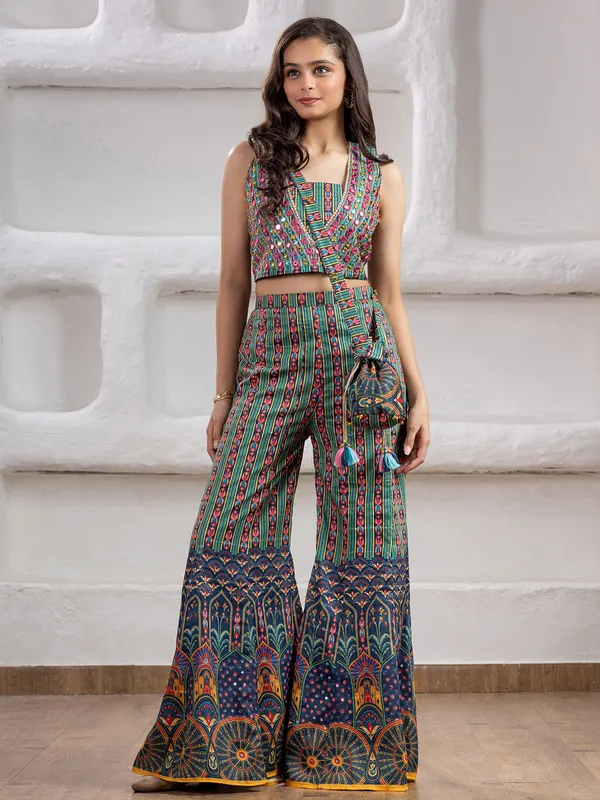 Green printed silk palazzo suit with pearls and mirrors