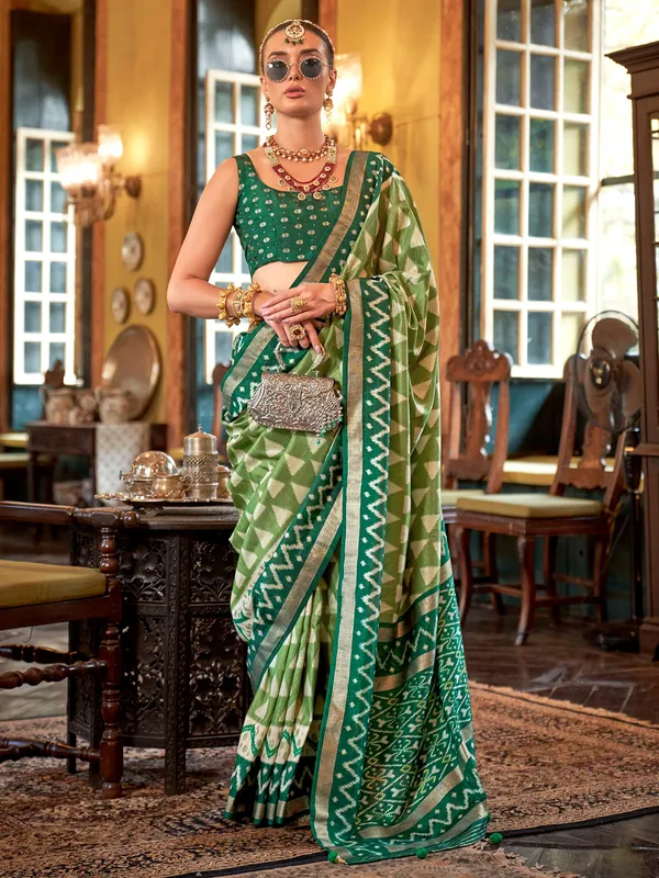 Green printed silk saree with zari work for women