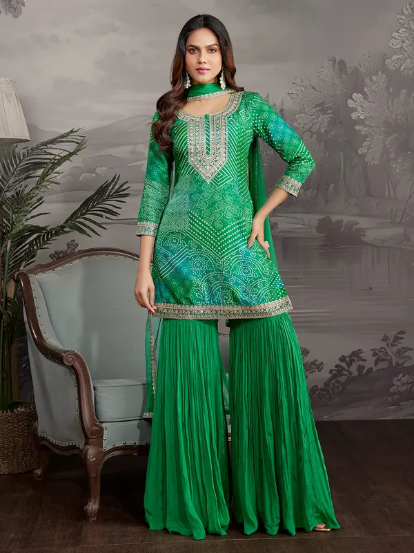 Green printed silk sharara suit with dupatta