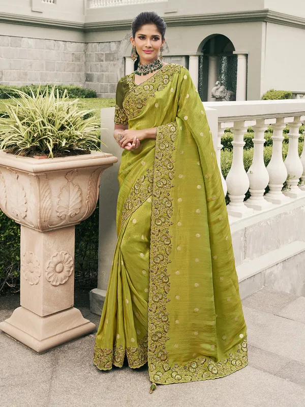 Green tissue silk saree with traditional touch
