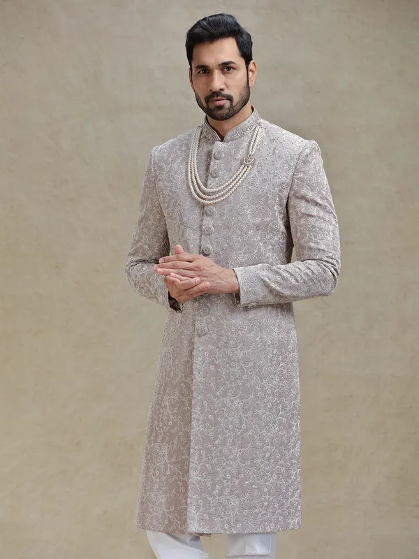 Grey silk sherwani in heavy stylish motifs