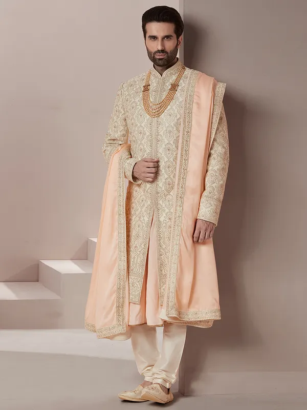 Groom and wedding raw silk sherwani in peach