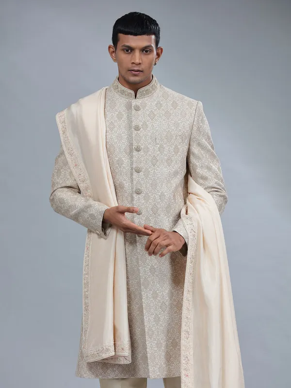 Groom style cream raw silk sherwani with jacquard prints