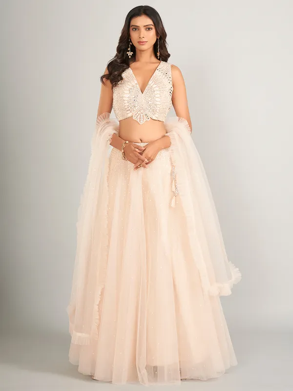 Heavy cream net lehenga choli for wedding