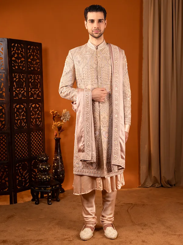 Heavy worked cream silk wedding sherwani for groom