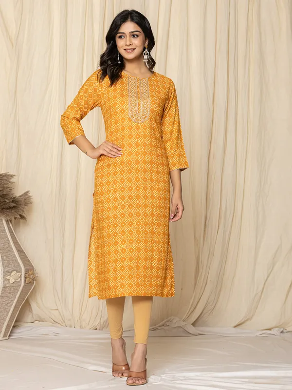Latest mustard yellow printed kurti in silk