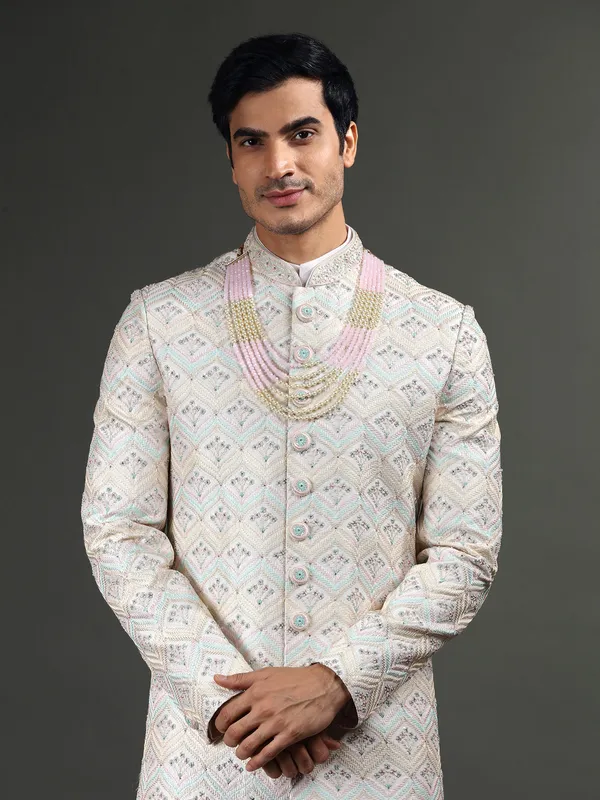 Lavish light pink raw silk sherwani