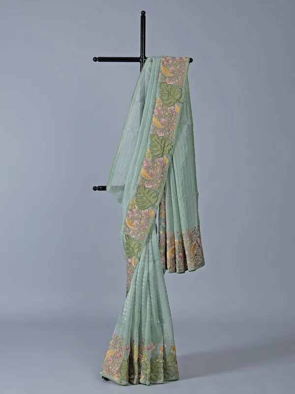Light blue organza saree with unstitched blouse