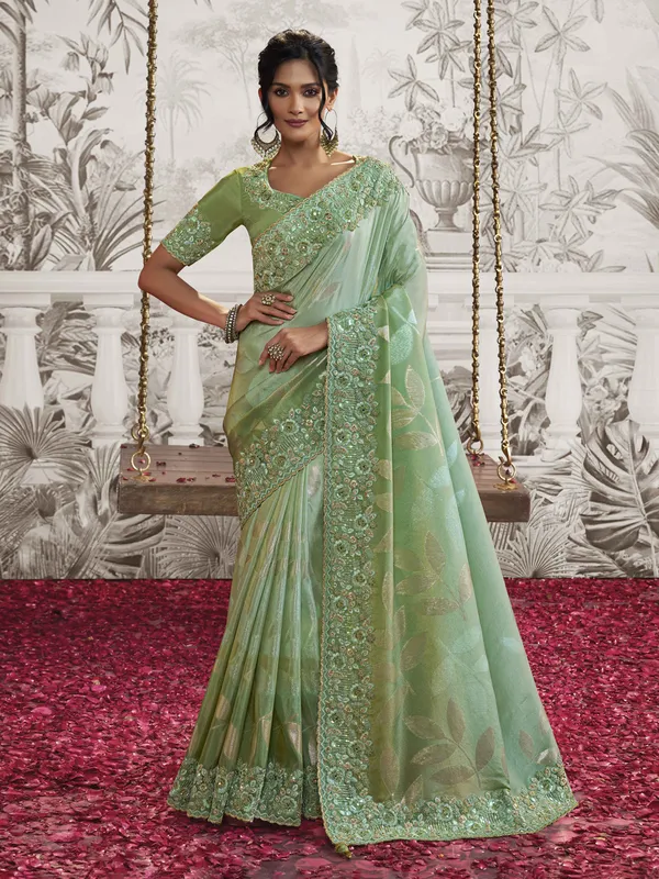 Light green festive wear silk saree with embroidery