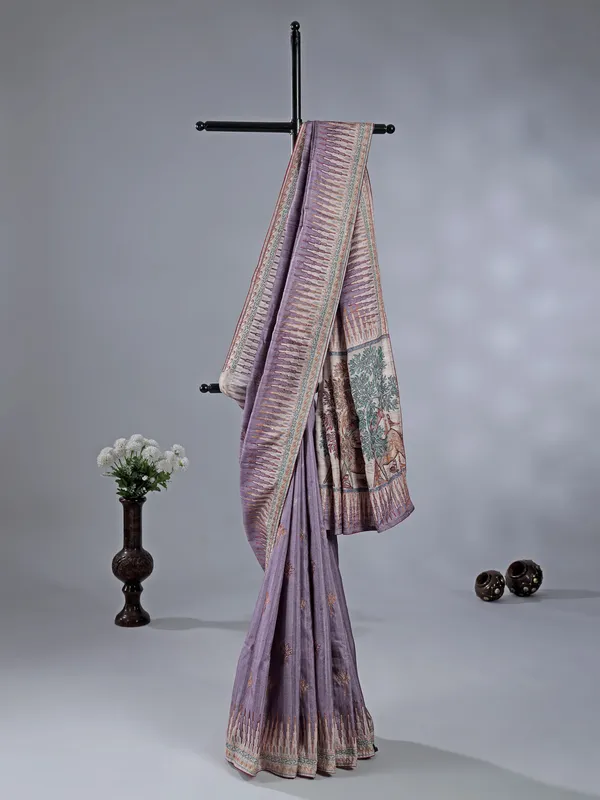 Light purple silk saree featuring traditional thread weaving