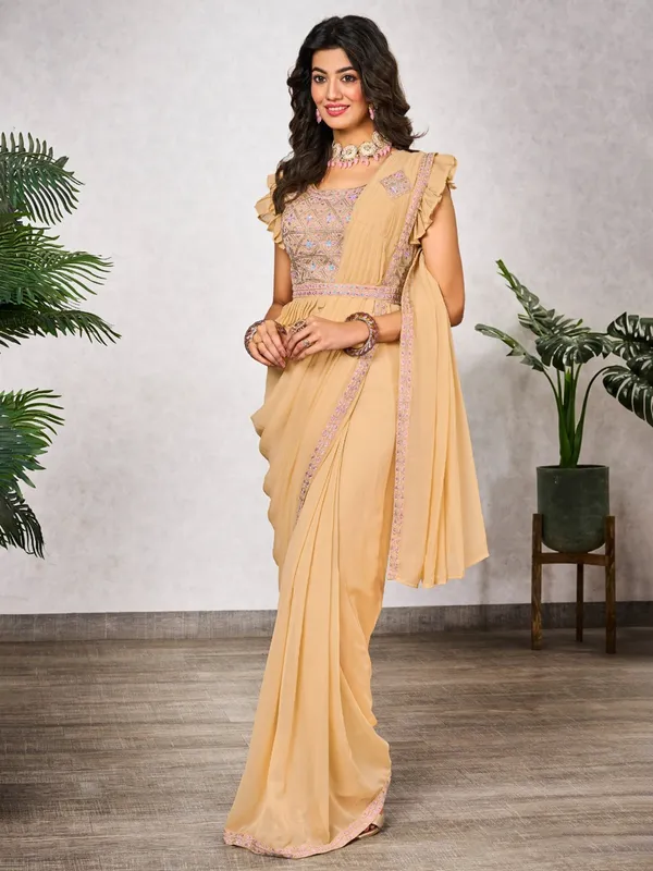 Light yellow wedding style shimmer georgette saree