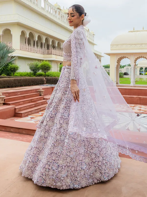 Lilac purple thread worked net lehenga choli