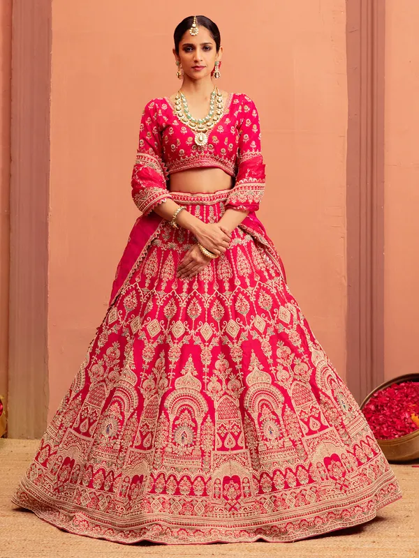 Magenta raw silk bridal lehenga choli with embellishments