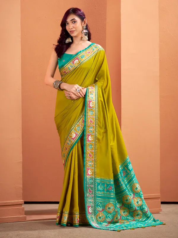 Mehendi green patola saree with traditional flair