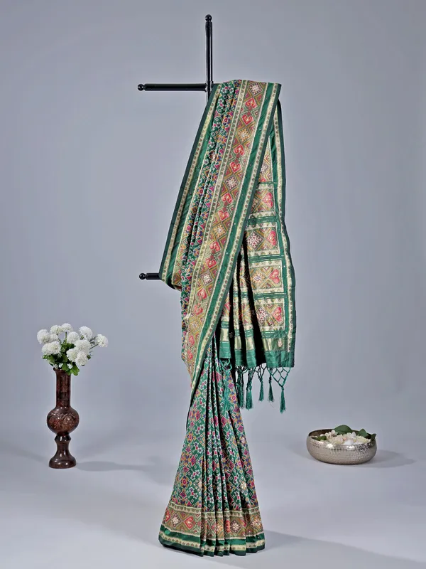 Mehendi green printed saree with traditional embellishments
