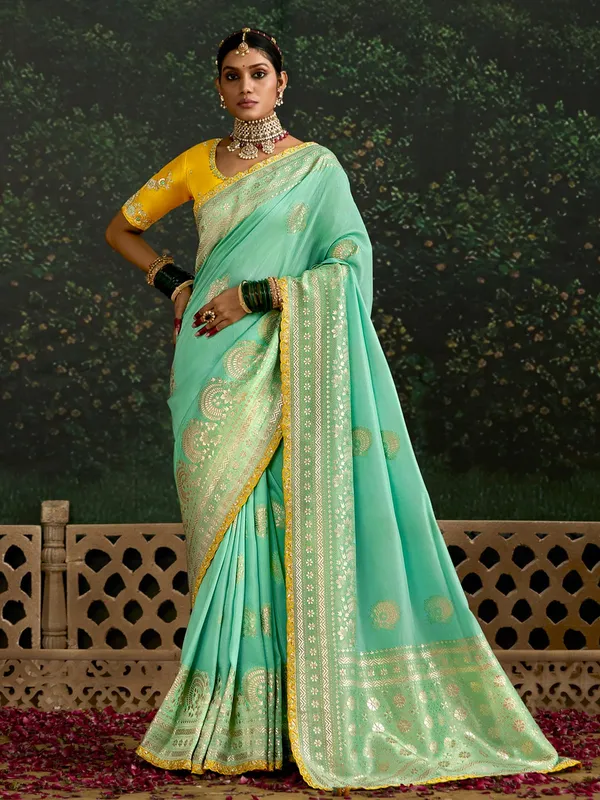 Mint green dola silk saree with zari weaving