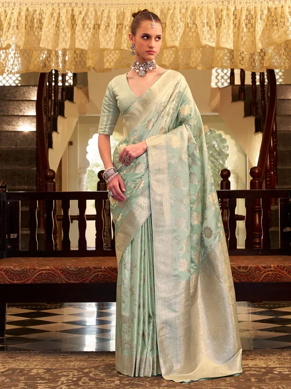Mint green satin silk saree with zari work