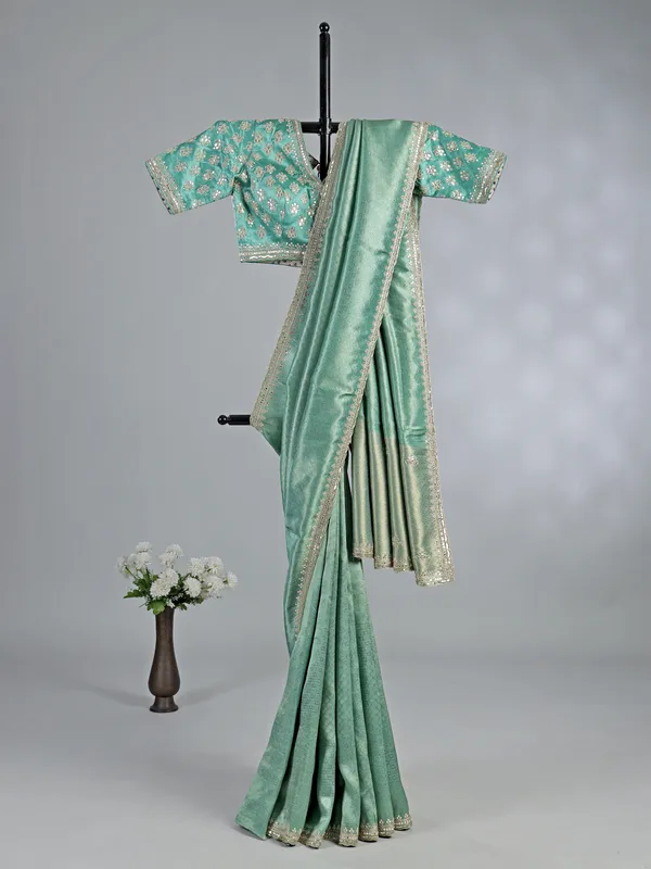 Mint green tusser dola silk saree with heavy work