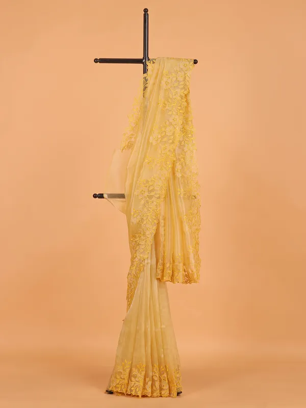 Mustard yellow organza saree for wedding wear