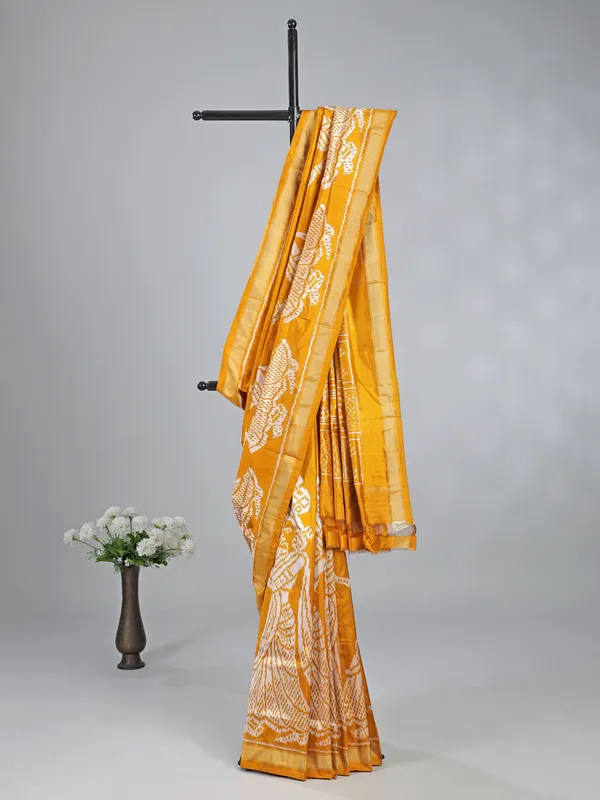 Mustard yellow patola silk saree with print