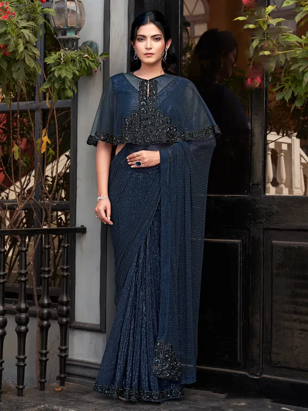 Navy blue net saree with embellished jacket blouse